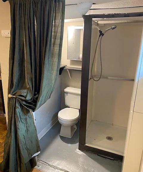 Bathroom features floor to ceiling storage and medicine cabinet