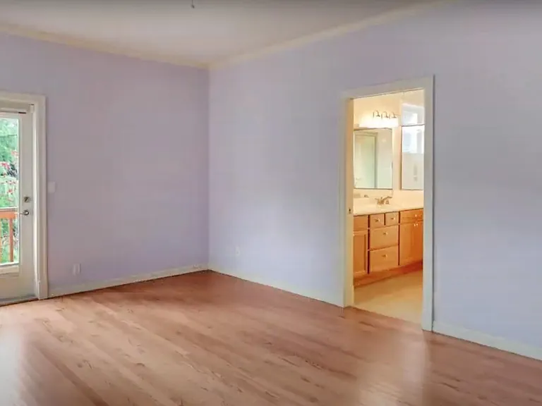 Master bedroom with private bathroom and access to deck