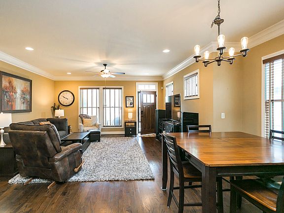 The tall ceilings feature elegant crown molding and gentle recessed lighting!