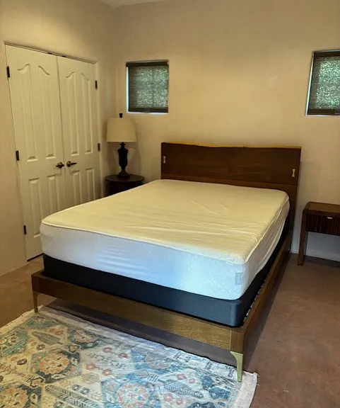 Bedroom that has queen sized bed, this bed will not be moved. It is a new bed.