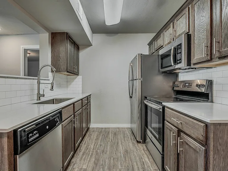 Experience the elegance of modern culinary design in this beautifully appointed kitchen.