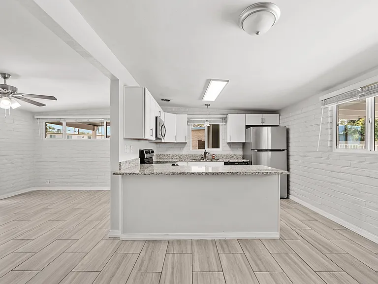 Sleek kitchen island with plenty of counter space for cooking and entertaining.