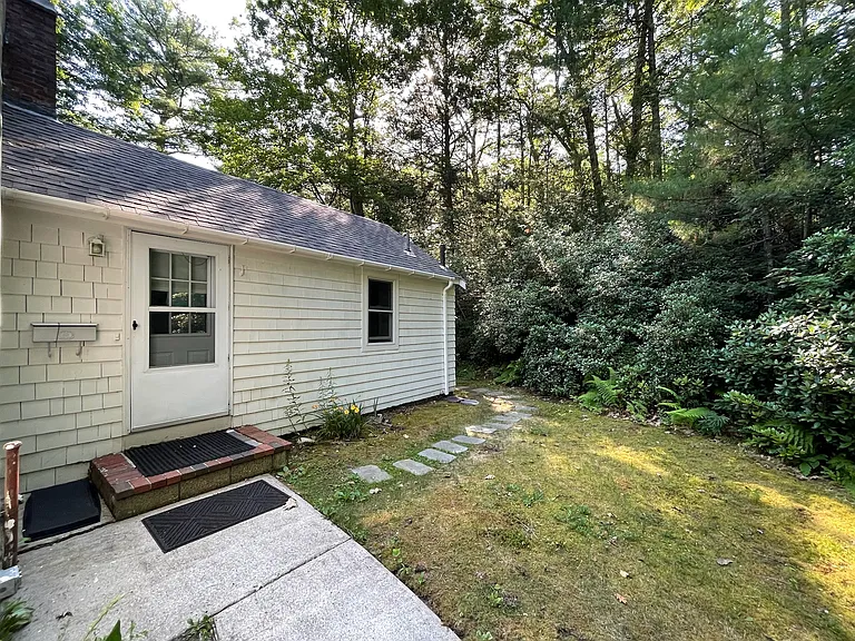 Walkway goes around the rear of the property for a secure main entrance and dedicated back yard space.