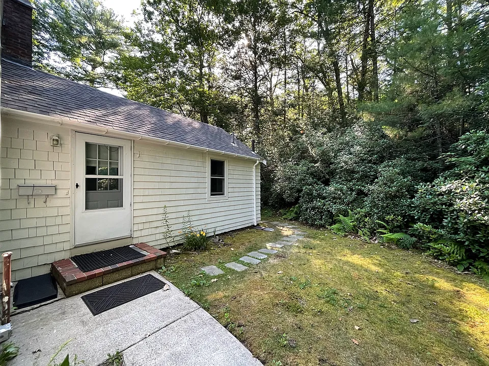Walkway goes around the rear of the property for a secure main entrance and dedicated back yard space.