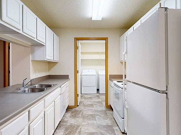Enjoy the convenience of an in-home laundry room just off the kitchenideal for multitasking on busy days.