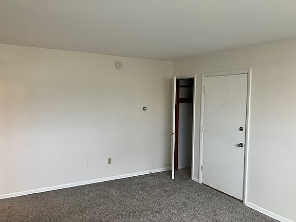 Living room with closet.