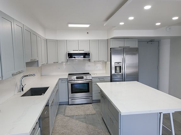 Kitchen and entry. Open space with huge island