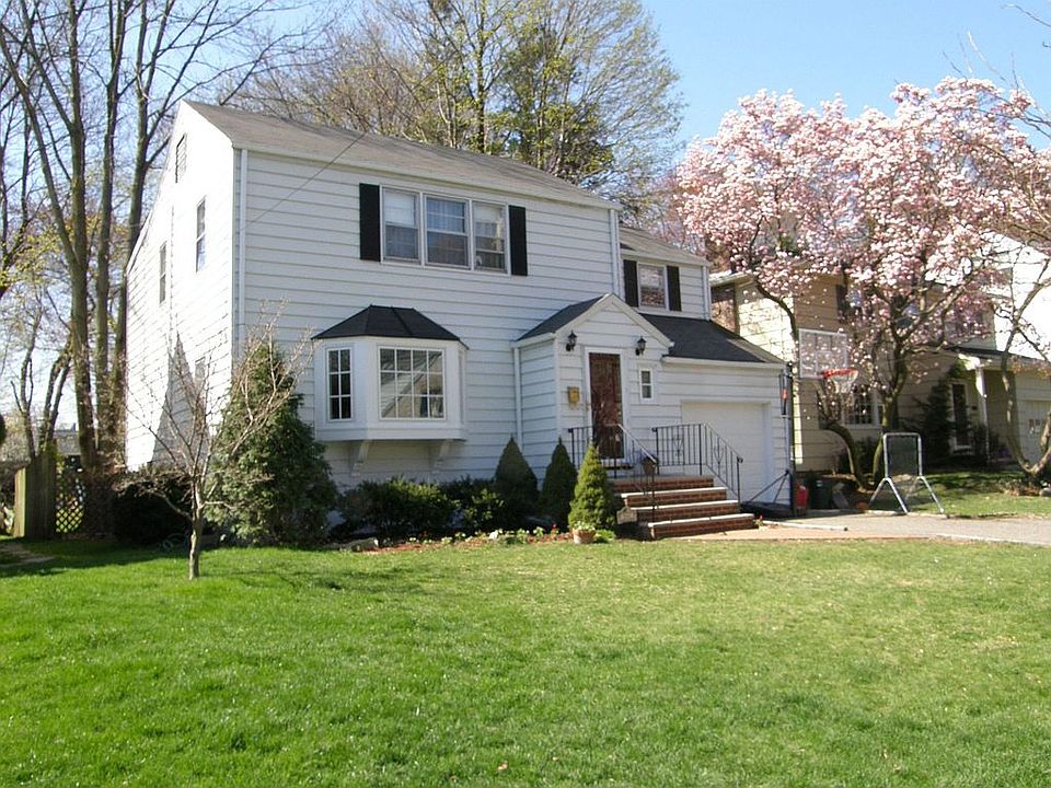 Deceivingly large, this spacious 4BR colonial is on a sidewalk lined street 