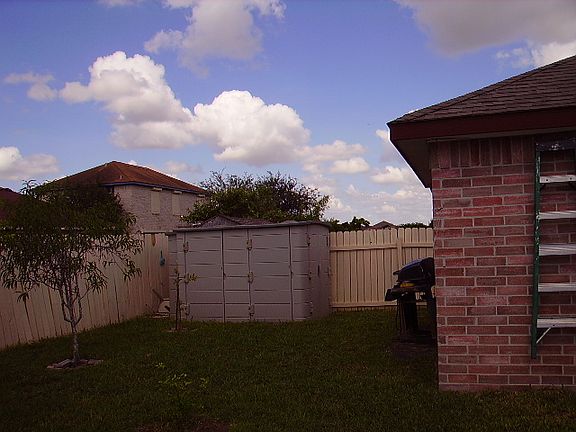 Yard with storage shed