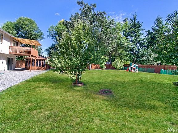 Beautiful backyard with fruit trees and garden space!