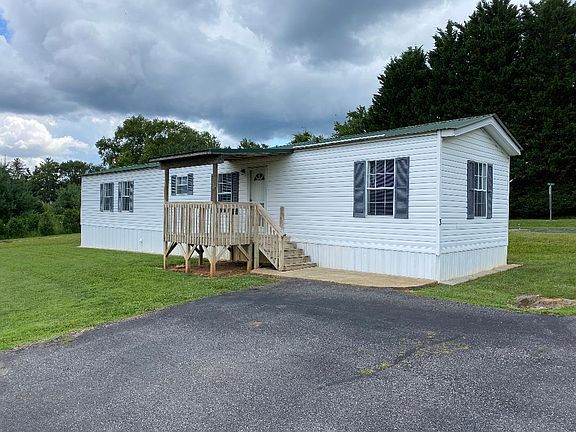 Front Angle of home with parking