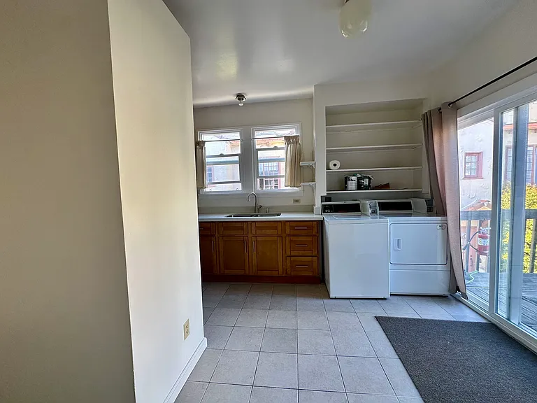 Coin operated washer/dryer in kitchen