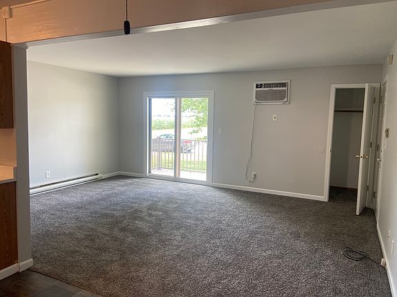 Large living room with new sliding doors exiting onto new deck