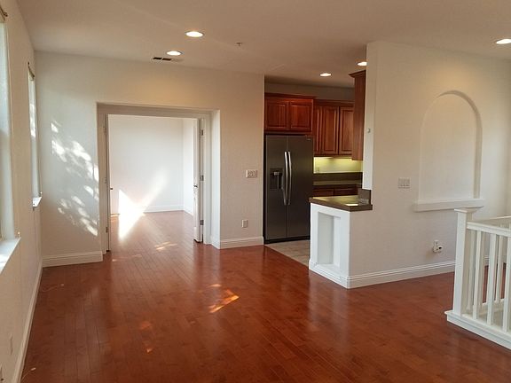 Livingroom with view into den/dining room and kitchen