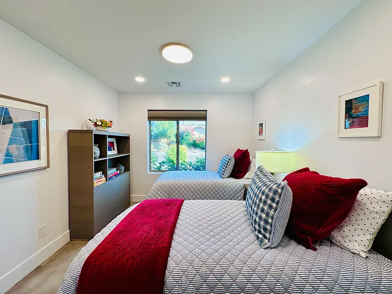 Guest Bedroom 3: 
Two Twin beds, ideal for kids, singles, or friends traveling together.