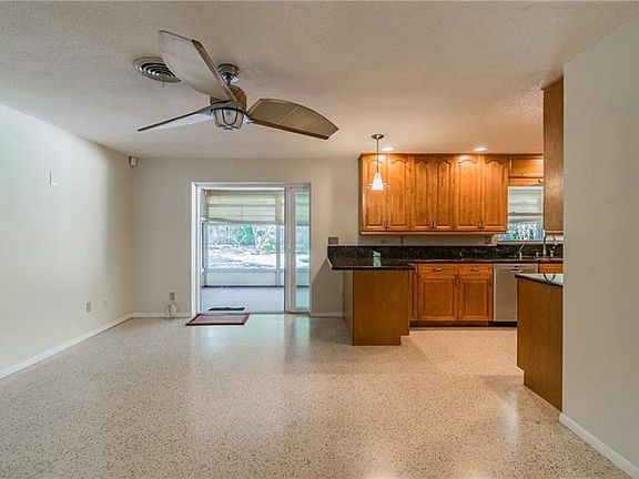 Great room off the kitchen with a new hurricane pocket slider door.