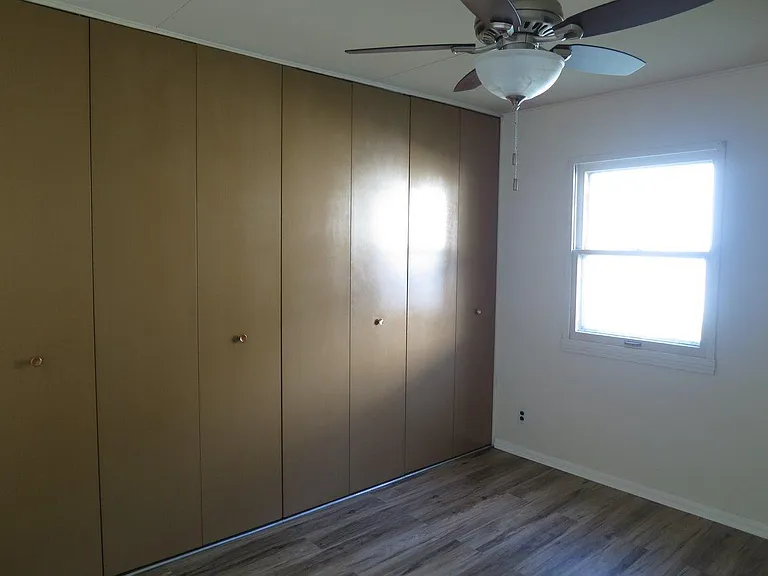 Back bedroom (South-East corner). Enormous closets.