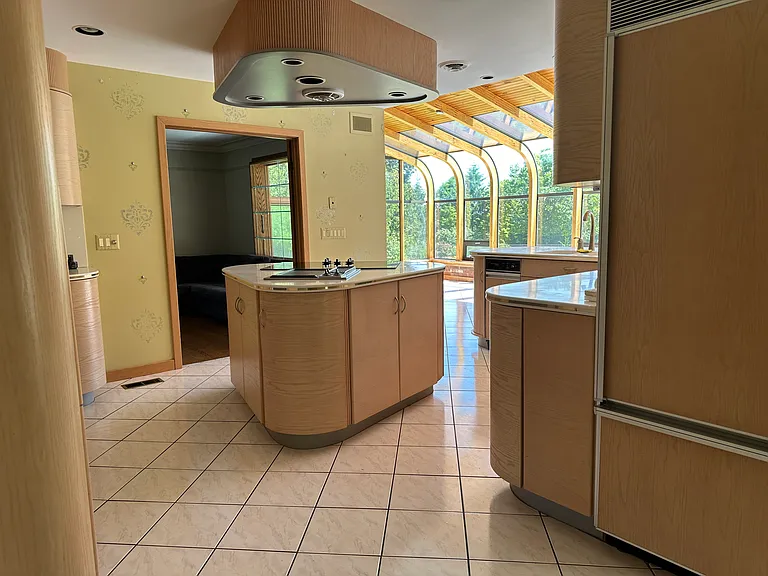 View of kitchen from front entrance.