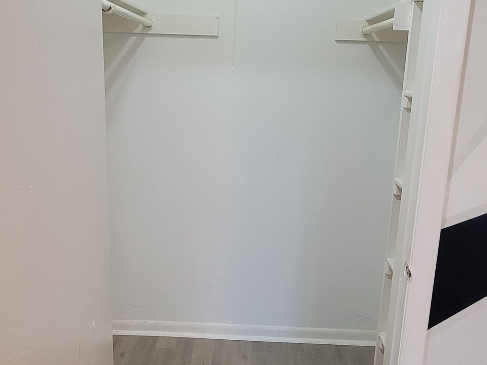 Walk-in closet with new hardwood floor
