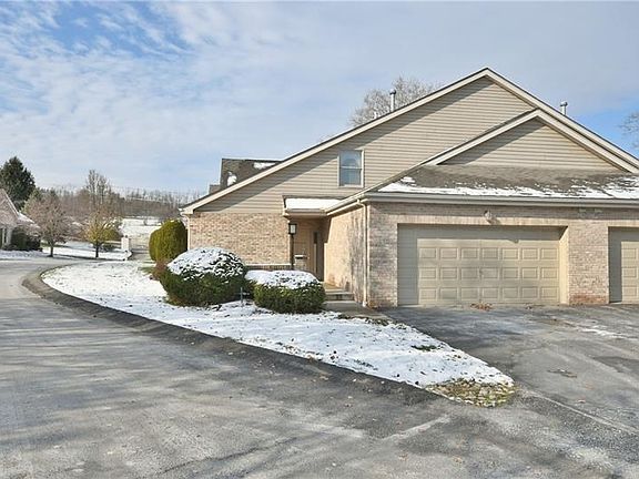 The 2 car garage is wide enough for additional storage. Both storage shelves in the garage remain with the home.