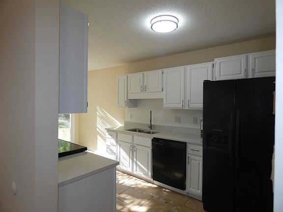 Kitchen with entrance off hallway. Also has an entrance to the seperate dining area.