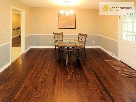 Dining area in convenient location between kitchen and door to d