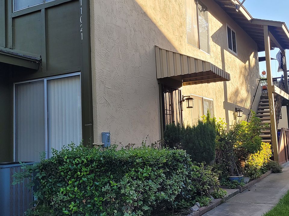front door of unit (stairs to upper unit neighbor)