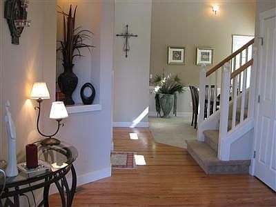 A warm and inviting entry with a niche to show off your favorite plants, artwork, candles