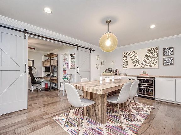 Wonderful entertaining space with large barn doors that lead into the study.