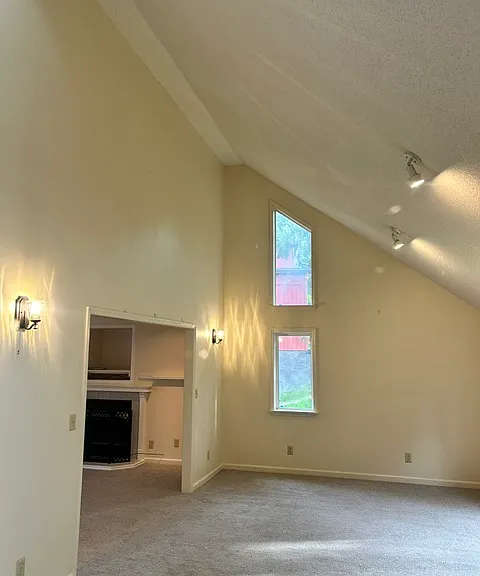 Open concept living room with vaulted ceilings
