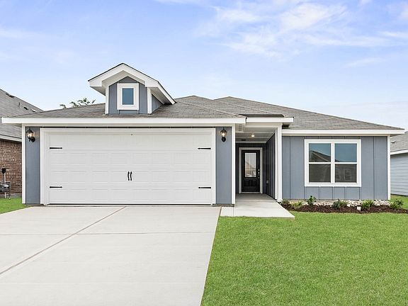 Beautiful one-story home with a siding exterior.