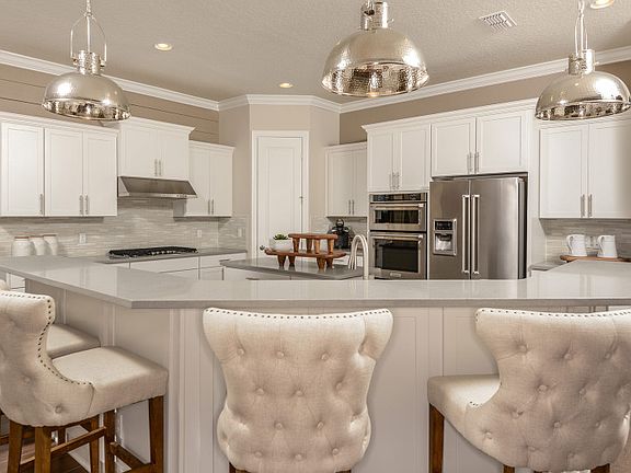 Welcoming kitchen island designs in your new construction homes are available new in Dr. Phillips