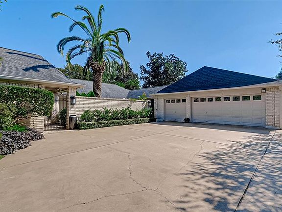 The oversized garage has two big storage closets, built-in cabinets, and a rear garage door for your golf cart!