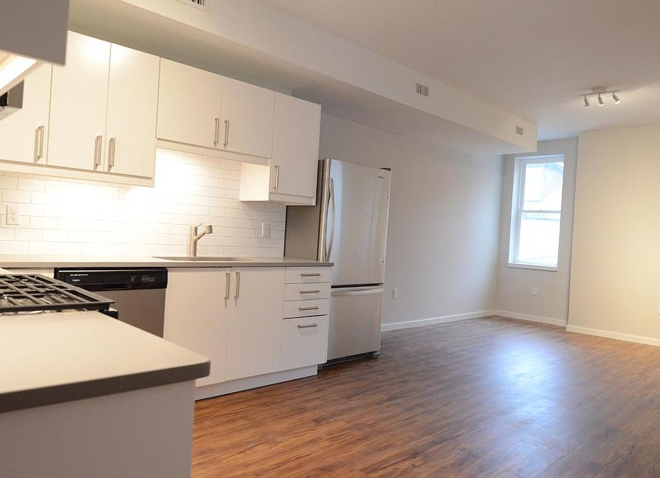 Kitchen opens to living area.