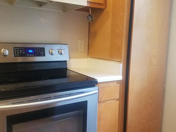 Kitchen has stove, refrigerator and dishwasher