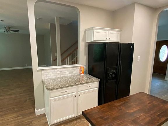 Kitchen open to living room and dining room