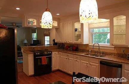 Upgraded kitchen with granite! : Cabinets- lighting, lazy susan & pull out drawers. Built in seating