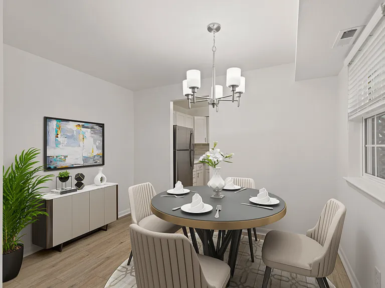 Prestige Kitchen Style and Dining Area with Luxury Vinyl Plank Flooring (shown here in a 2-bedroom floor plan with model furniture and decor)