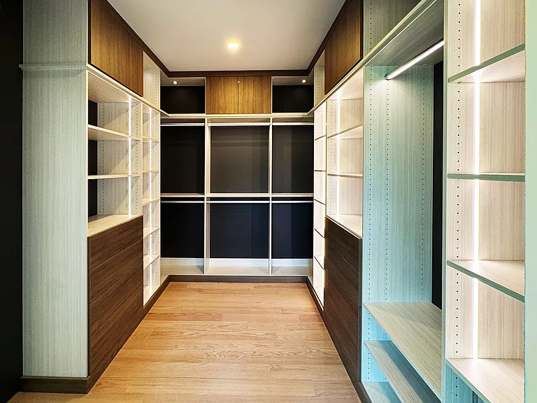 Primary bedroom walk-in closet