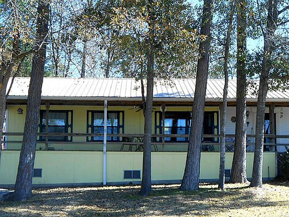 Wonderful lake view from home and wide front porch. Note: Steel roof over home, porch, garage and ca