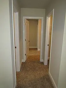 Master Bedroom looking at the hallway to the Master Bathroom and walk in closets #1 and #2.