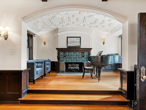The barrel vaulted room is accented by the plasterwork of the ceiling.