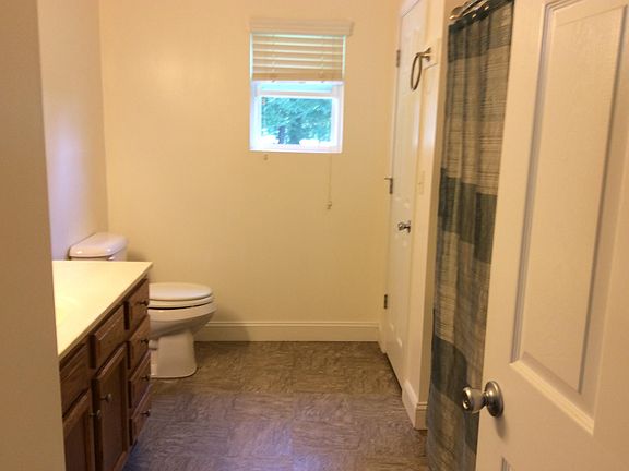 Bathroom with tub/shower combo and full size linen closet