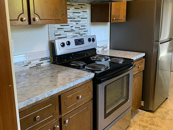 New refurbished counter tops and brand new tile back splash. New vinyl flooring and paint.