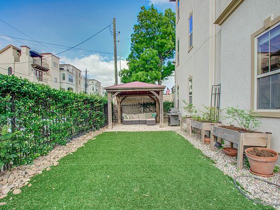 Beautiful corner lot!! Light on all three sides of home, uncommon for the neighborhood. OVER 1,200 sq ft fenced in yard with patio, gazebo, raised garden beds (blueberries included). Yard has artificial grass so perfect for little ones or pets (yes pets a