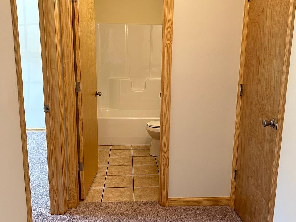 Hallway w/linen closet. Full size bathroom and secondary bedroom entrance.