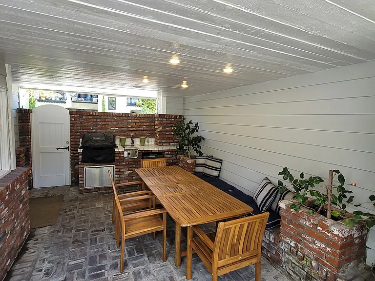 Downstairs covered patio with grill