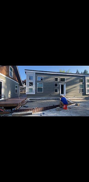 Back yard area showing homes
