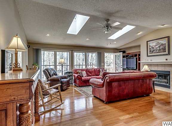 Spacious living room with beautiful hardwood floors and gas fireplace.