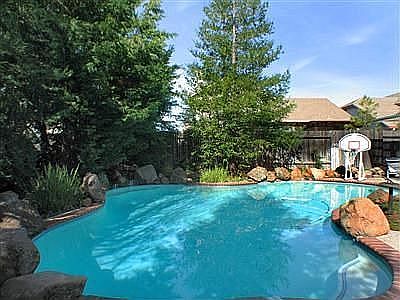 solar heated pool with waterfall